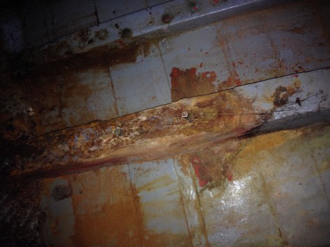 This frame has a large spongy area of rot where the floor bolts through.