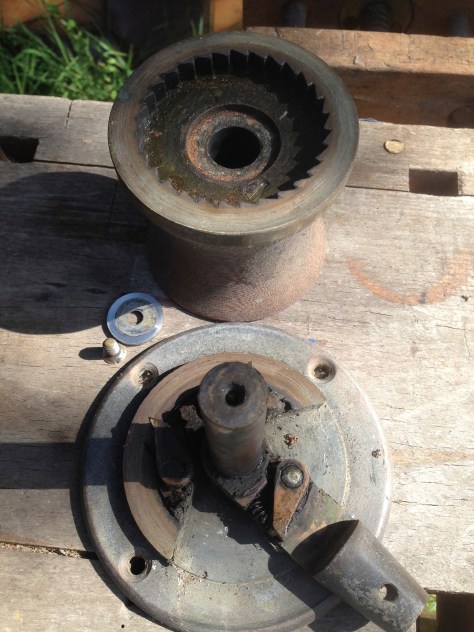 An old tufnol and bronze winch, dismantled ready for cleaning.
