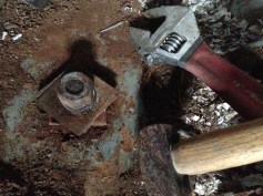 Undo the nut, drive the bolt out..... simples!